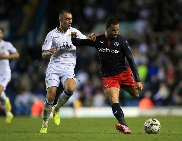 Battle for the Ball: Tommaso Bianchi vs. Hal Robson-Kanu in the Intense Sky Bet Championship Clash at Elland Road