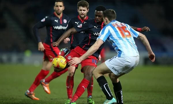 Hope Akpan's Determined Shot: Reading FC vs. Huddersfield Town in Sky Bet Championship