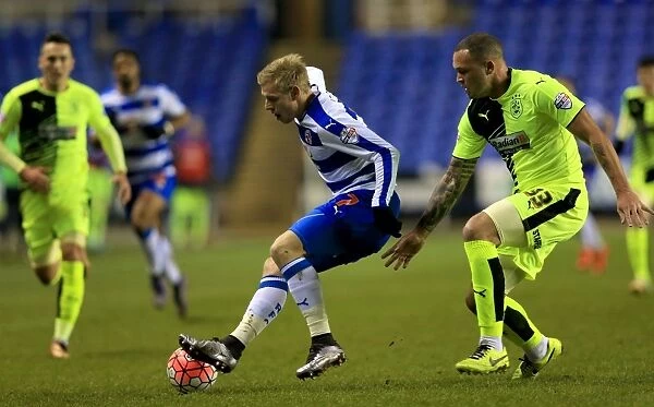 Matej Vydra vs. Joel Lynch: A Battle in the Emirates FA Cup Third Round Replay - Reading's Vydra Clashes with Huddersfield's Lynch at Madejski Stadium