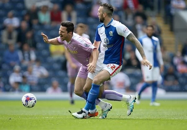 Yann Kermorgant vs. Shane Duffy: Intense Tackle in Sky Bet Championship Match between Blackburn Rovers and Reading at Ewood Park
