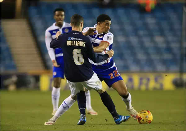 Battle for the Ball: Williams vs. Blackman in the Intense Millwall vs. Reading Championship Clash