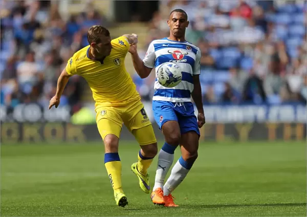Intense Rivalry: Chris Wood vs. Anton Ferdinand Clash in Sky Bet Championship Match between Reading and Leeds United
