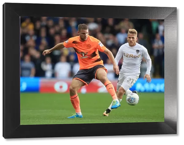 Leeds United vs. Reading: Intense Battle for the Ball between Saiz and van den Berg