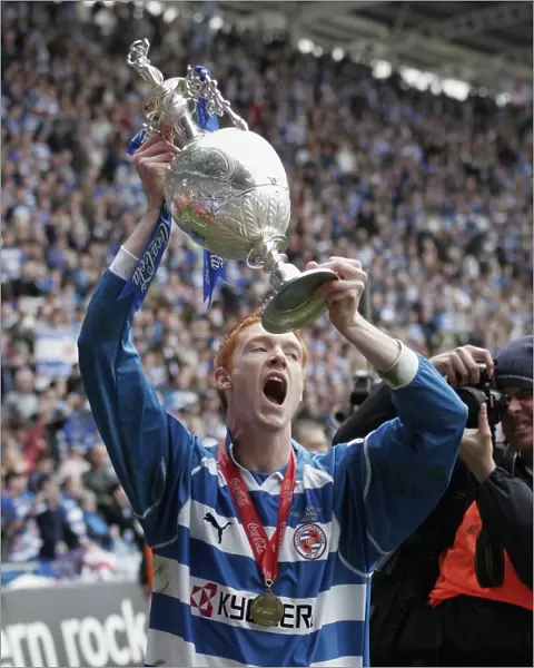 Dave Kitson raises the trophy to the fans