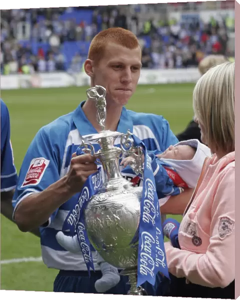Steve Sidwell shows his wife the trophy