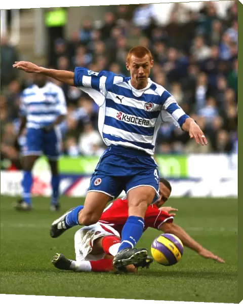 Steve Sidwell rides a challenge from Luke Young