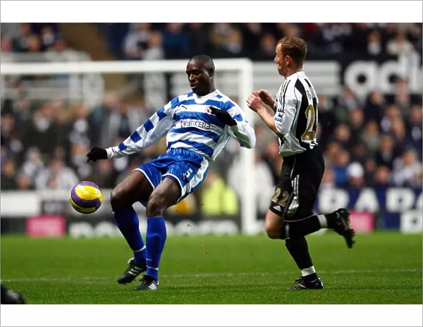 Ibrahima Sonko clears the ball from Nicky Butt