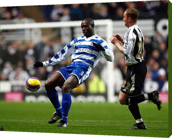 Ibrahima Sonko clears the ball from Nicky Butt