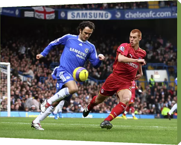 Steve Sidwell chases down Ricardo Carvalho as he tries to clear the ball