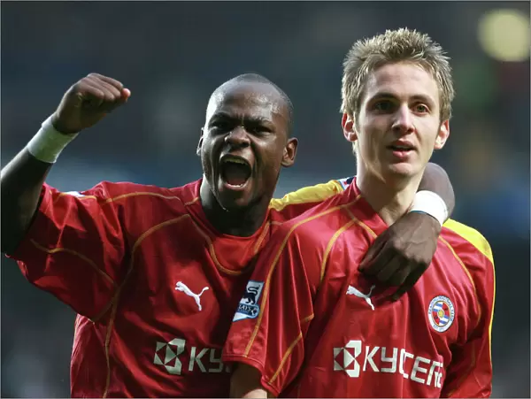 Leroy Lita and Kevin Doyle salute Reading fans after Michael Essiens own goal to make the score 2-2