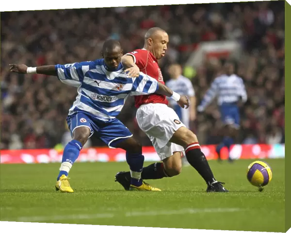 Leroy Lita battles with Michael Silvestre in the 3-2 defeat at Old Trafford