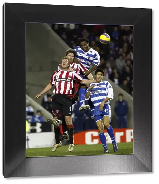 Andre Bikey out jumps the Sheffield Utd defence to win the ball