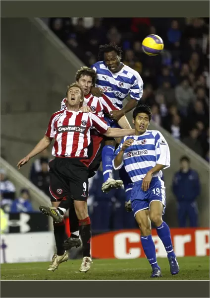 Andre Bikey out jumps the Sheffield Utd defence to win the ball
