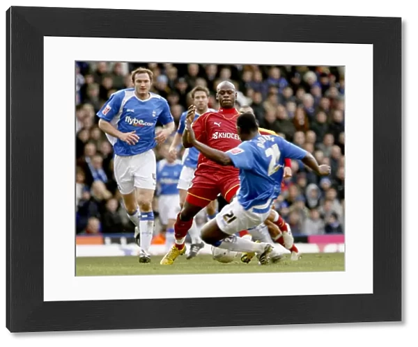 Leroy Lita takes on Bruno N Gotty in the 3-2 defeat of Birmingham City