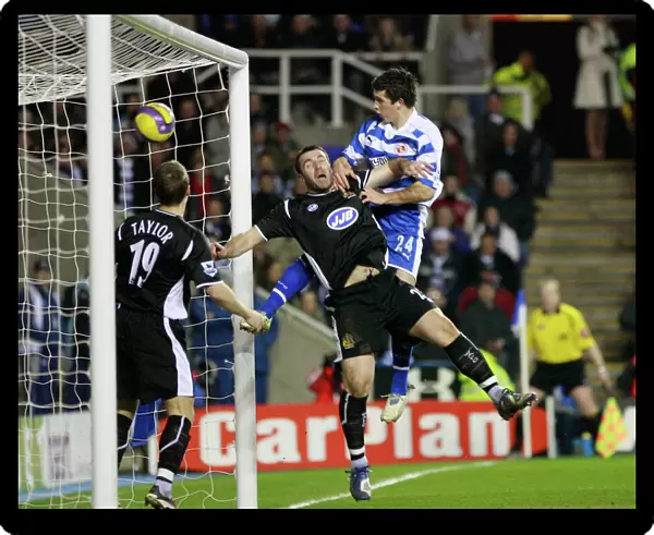 Shane Long rises above Wigans David Unsworth to score his 51st minute goal