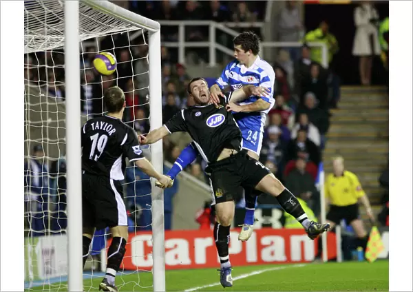 Shane Long rises above Wigans David Unsworth to score his 51st minute goal
