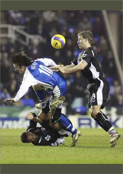 Stephen Hunt gets a shove from Wigans Ryan Taylor