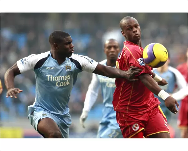 Leroy Lita challenged by Manchester Citys Micah Richards