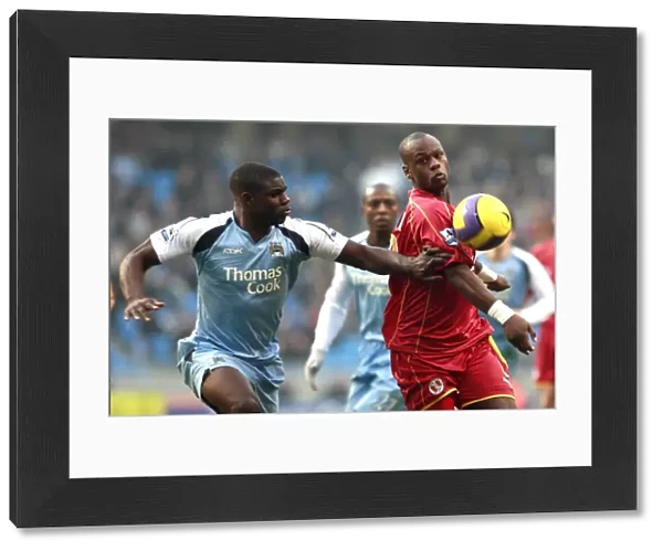 Leroy Lita challenged by Manchester Citys Micah Richards