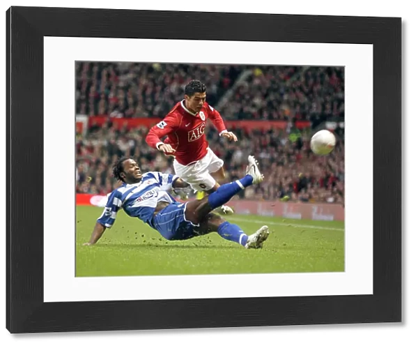 Andre Bikey tackles Cristiano Ronaldo at Old Trafford in the FA Cup 5th Round