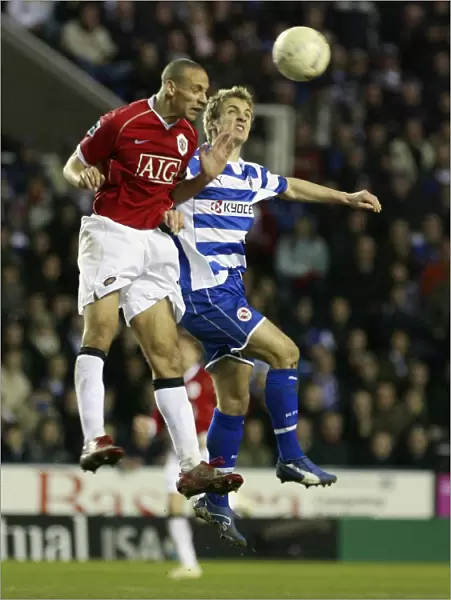 Kevin Doyle and Rio Ferdiand leap for the ball in the narrow 3-2 FA Cup defeat at the Madejski