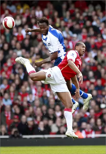 Andre Bikey out jumps Julio Baptista to win the ball