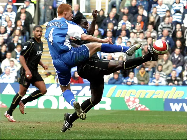 Steve Sidwell challenges Linvoy Primus for the ball