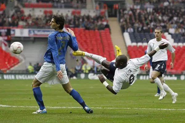 Leroy tries a spectacular shot from the edge of the box for England at the new Wembley Stadium