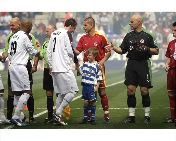The club Mascot meets the team before the game at Bolton Wanderers