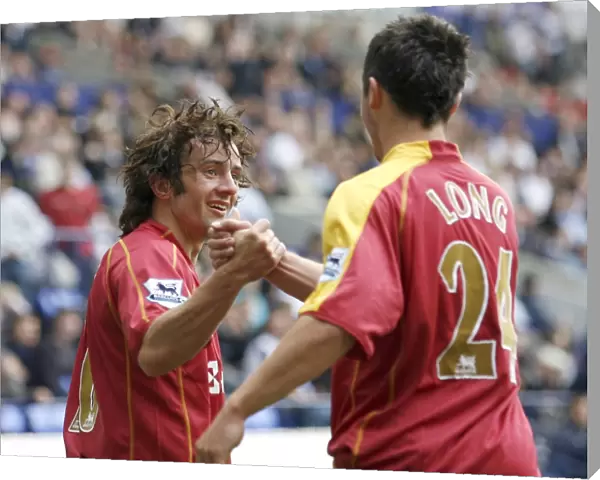 Shane Long goes to congratulate Stephen Hunt on scoring his 92nd minute goal at the Reebok Stadium