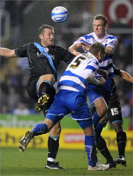 Battle for the Ball: Mills, Pearce, and Howard in the Intense Reading vs. Leicester City Championship Showdown at Madejski Stadium
