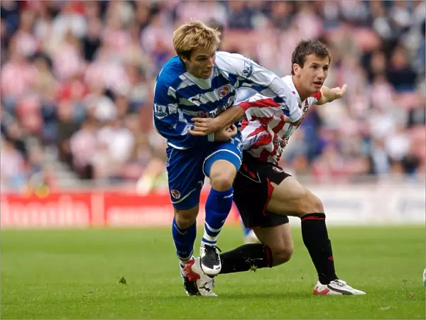 Bobby Convey takes on the Sunderland defence