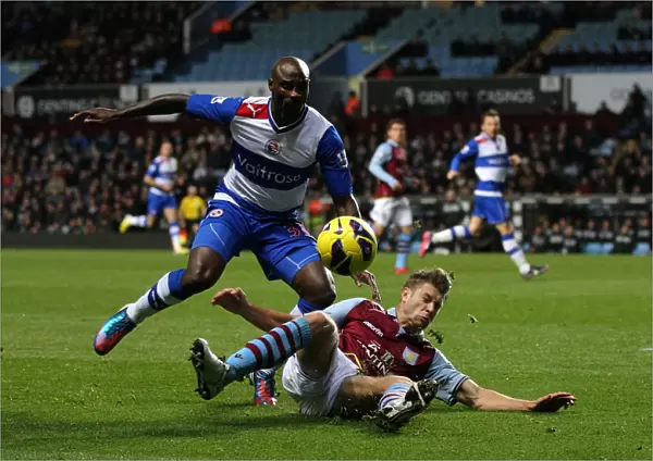 Intense Battle for Ball Possession: Nathan Baker vs Jason Roberts, Aston Villa vs Reading, Premier League (November 27, 2012)