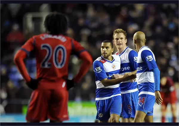 Reading FC's Triumph: Mariappa, Pearce, and Kebe's Celebration as Lukaku Disappointedly Looks On (January 12, 2013)