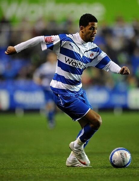 Action-Packed Championship Clash: Jobi McAnuff Battles for Reading's Possession Against Leicester City at Madejski Stadium