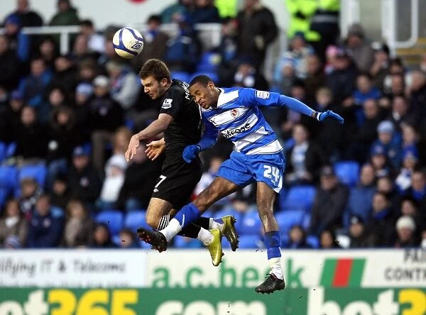 Aerial Battle: Shaun Cummings vs. James Morrison in the FA Cup Third Round Clash between Reading and West Bromwich Albion