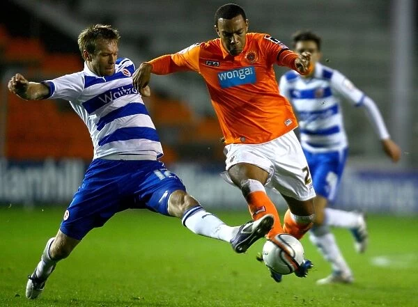 Battle for the Ball: Gorkss vs. Phillips - Championship Clash between Reading and Blackpool at Bloomfield Road