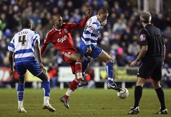 Battle for the Ball: Intense Rivalry - Ingimarsson vs Ngog in Reading vs Liverpool's FA Cup Clash