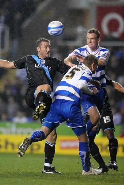 Battle for the Ball: Mills, Pearce, and Howard in the Intense Reading vs. Leicester City Championship Showdown at Madejski Stadium