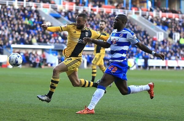 Battle for the Ball: Ola John vs. Ryan Fredericks in Reading's Championship Showdown against Fulham