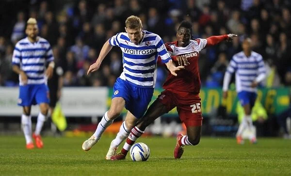Battle for the Ball: Pogrebnyak vs. Omeruo - Sky Bet Championship Showdown between Reading and Middlesbrough