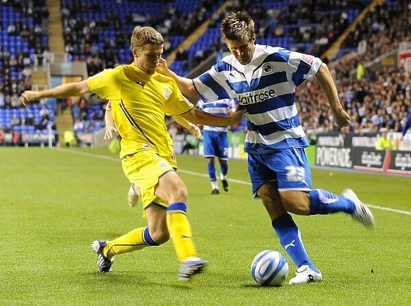 Battle for the Ball: Rasiak vs. Matthews in the Intense Championship Clash between Reading and Cardiff City