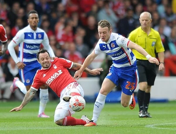Battle for the Ball: Reid vs. Taylor in Nottingham Forest vs. Reading Championship Clash at City Ground
