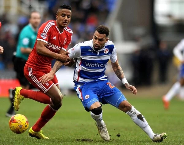 Battle for the Ball: Williams vs. Mancienne in the Intense Sky Bet Championship Clash between Reading and Nottingham Forest