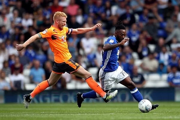 Birmingham City vs. Reading: Intense Battle for the Ball between Jacques Maghoma and Paul McShane