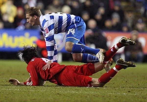 Brian Howard Fouls Alberto Aquilani: A Moment from the FA Cup Third Round Clash Between Reading and Liverpool at Madejski Stadium