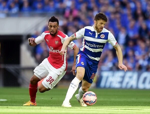 FA Cup Semi-Final: Intense Battle between Reading's Jamie Mackie and Arsenal's Francis Coquelin at Wembley Stadium