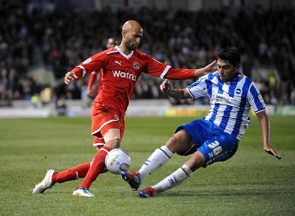 Intense Battle: Gonzalo Jara-Reyes vs. Jimmy Kebe in the Npower Championship Clash between Brighton & Hove Albion and Reading at AMEX Stadium