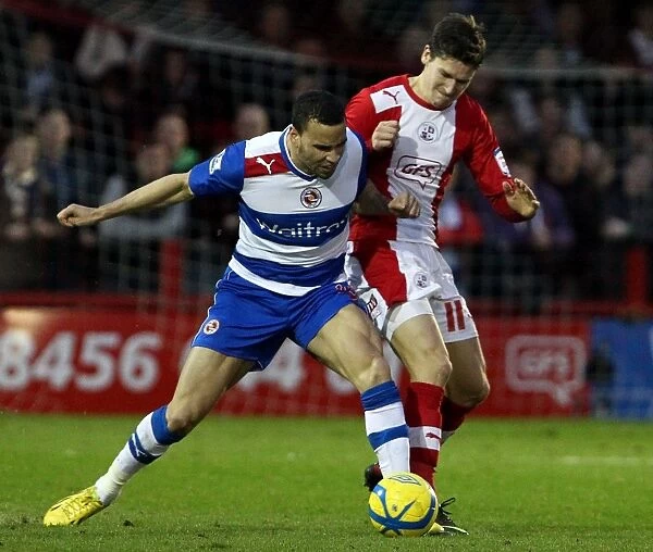 Intense Battle: Hal Robson-Kanu vs. Josh Simpson in FA Cup Third Round Clash between Crawley Town and Reading