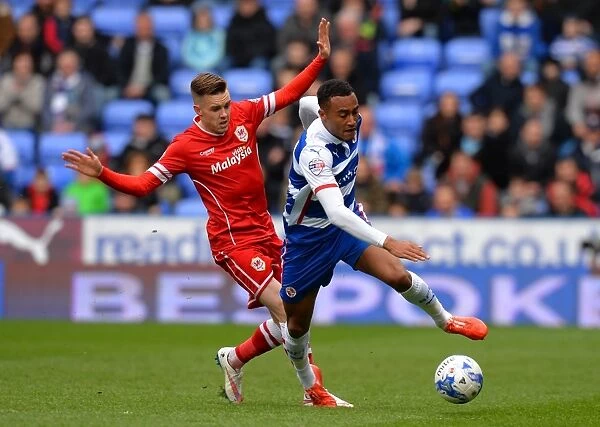 Intense Clash: Jordan Obita vs. Craig Noone - A Hard-Fought Tackle in the Sky Bet Championship Match between Reading and Cardiff City